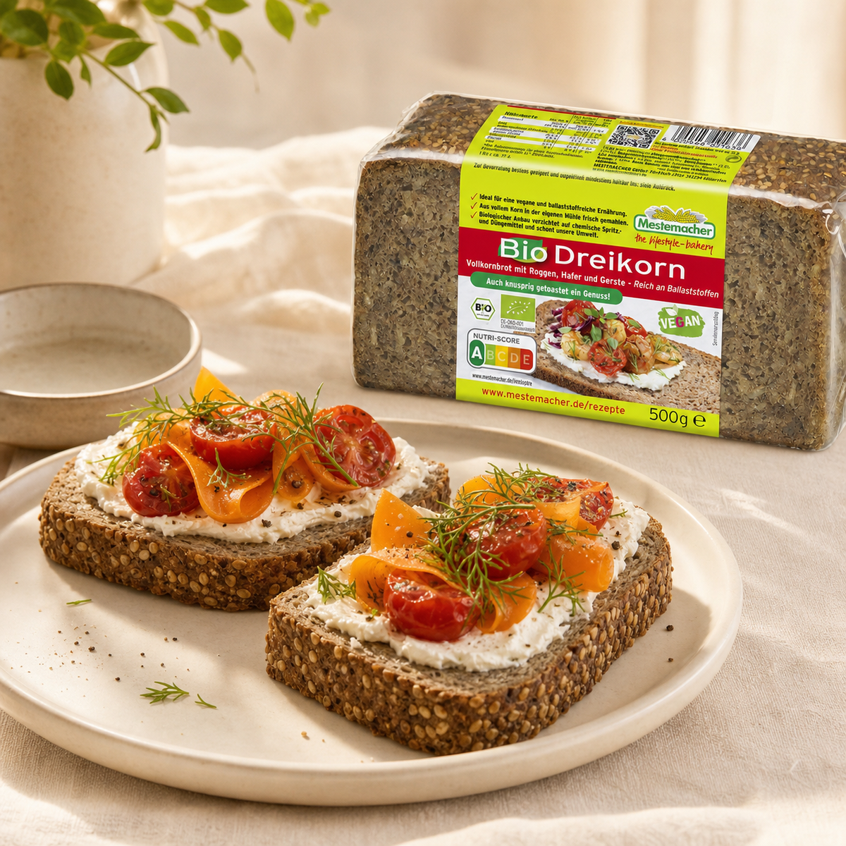 Mestemacher organic three grain rye bread 500g, served, with the pack beside it