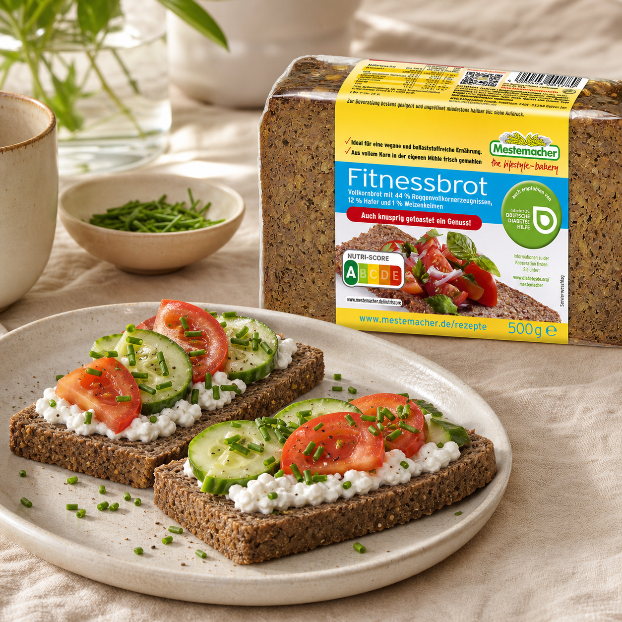 Mestemacher Fitnessbrot German wholegrain rye and oat bread 500g, served, with the pack beside it
