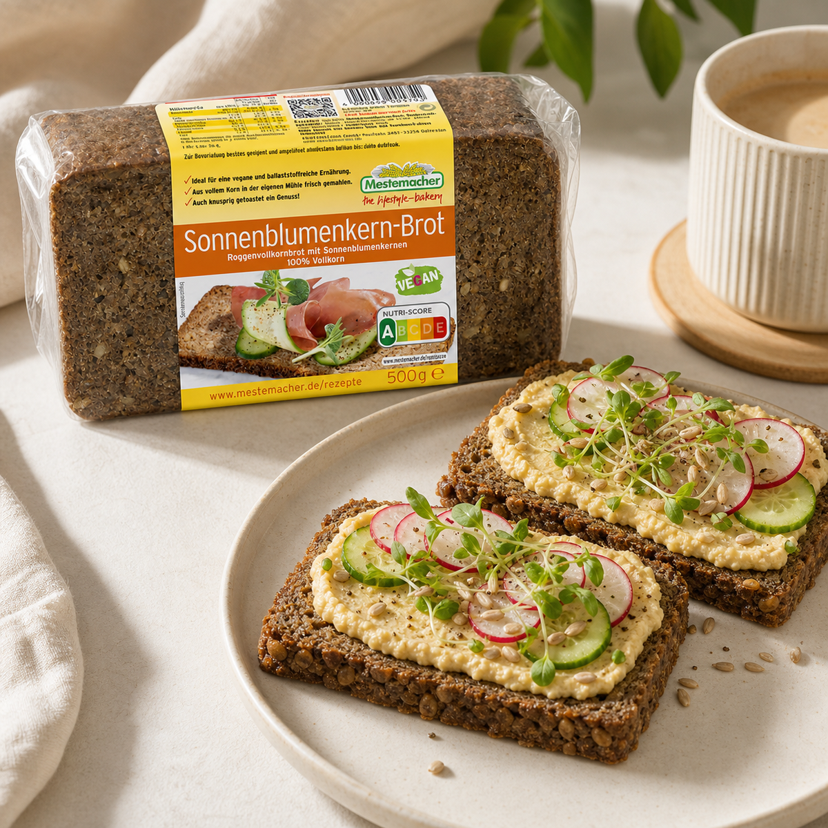 Mestemacher Sonnenblumenkern Brot German sunflower seed rye bread 500g, served, with the pack beside it